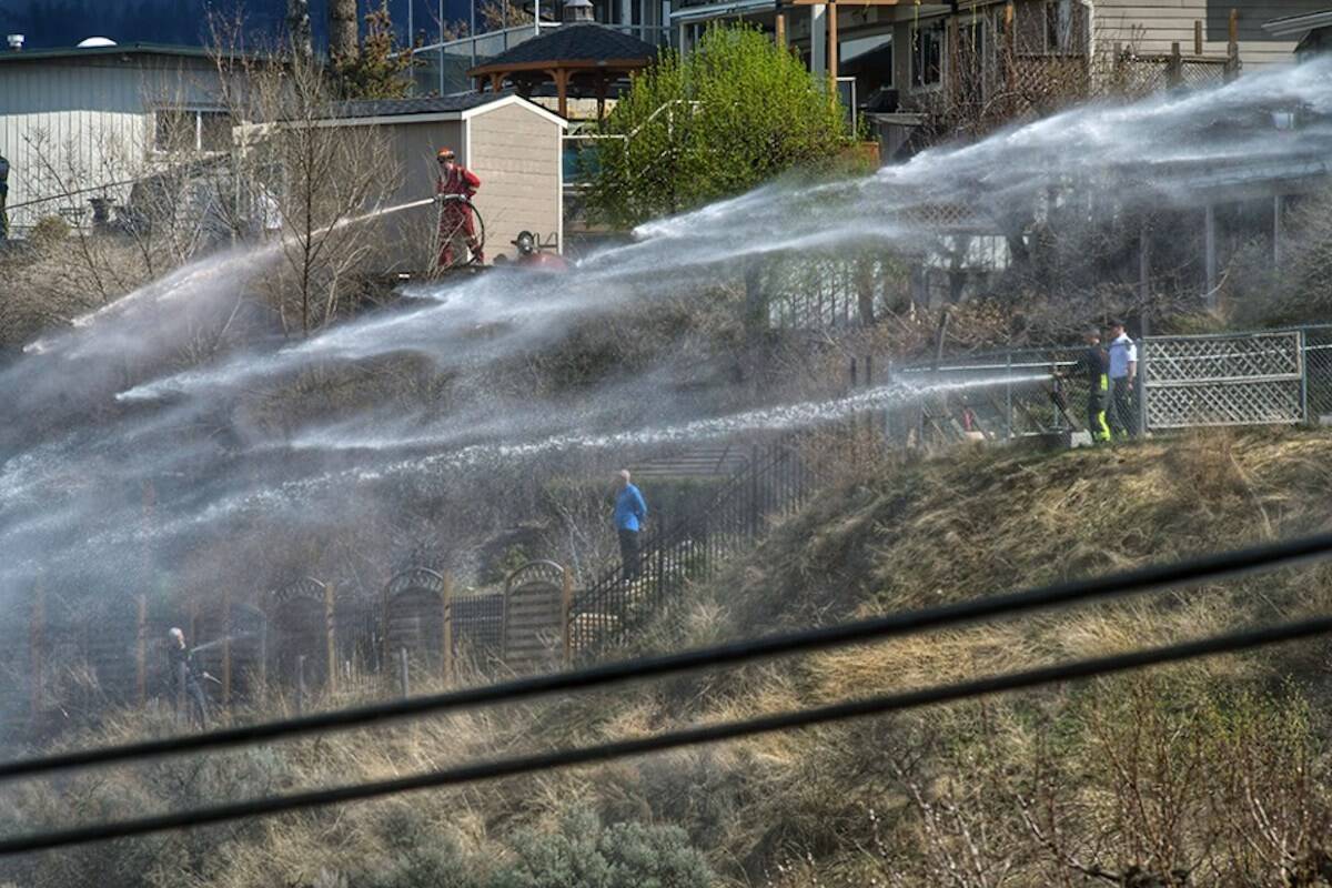 Firefighters work on dousing the blaze. (Dave Eagles/KTW)