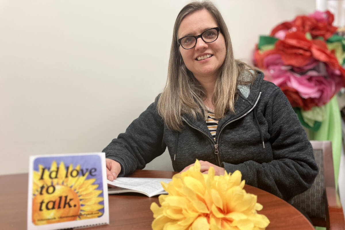 Sharyn Sadauskas created the I’d Love to Talk initiative and routinely visits Greater Victoria to restock sign supplies in places such as Mocha House. (Christine van Reeuwyk/News Staff)