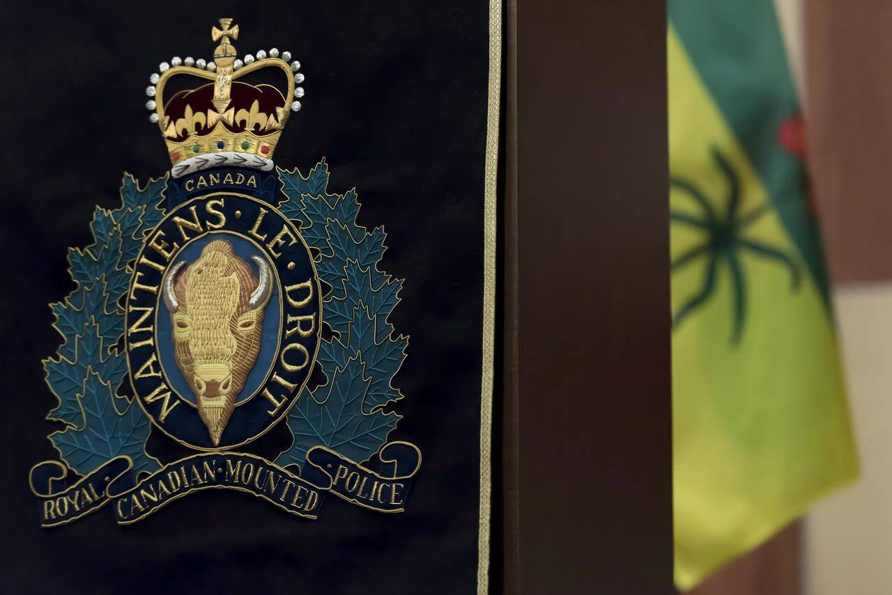 An RCMP insignia hangs from a podium at Depot Division in Regina, Saskatchewan on Thursday, April 19, 2018. THE CANADIAN PRESS/Michael Bell