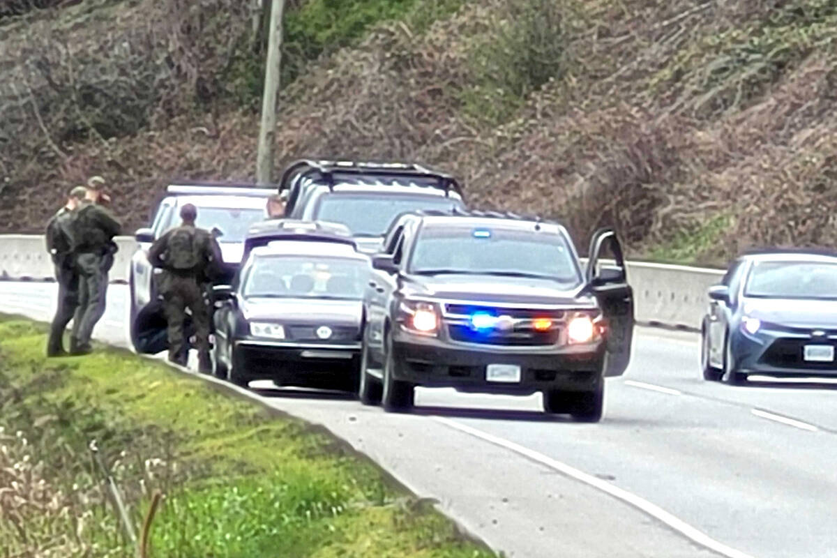Members of IERT surrounded a vehicle stopped on Lougheed Highway on Friday afternoon in connection to a Port Moody kidnapping. (Neil Corbett/The News)