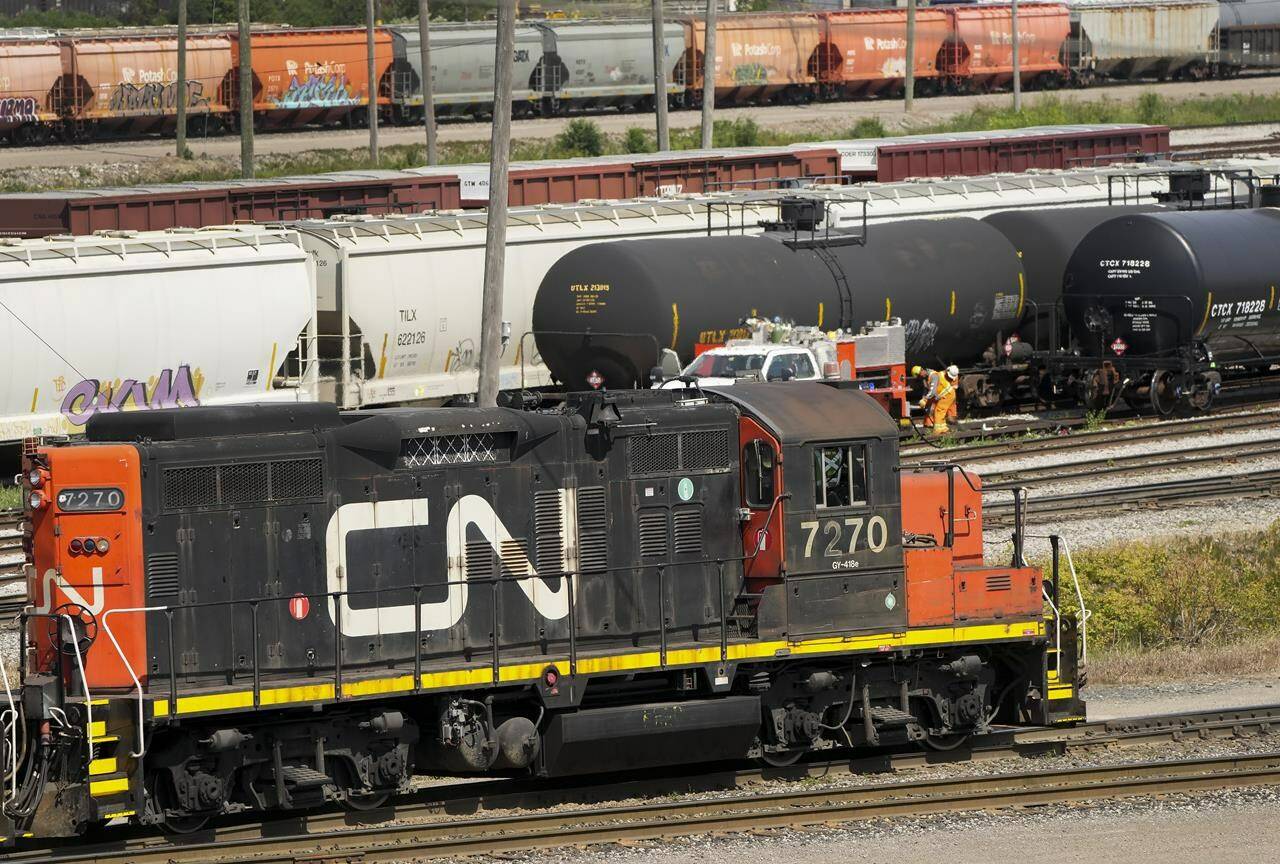 Canadian National Railway Co. says it reaped record first-quarter revenues due a bumper grain crop and higher oil prices. CN rail trains are shown at the CN MacMillan Yard in Vaughan, Ont., on Monday, June 20, 2022. THE CANADIAN PRESS/Nathan Denette