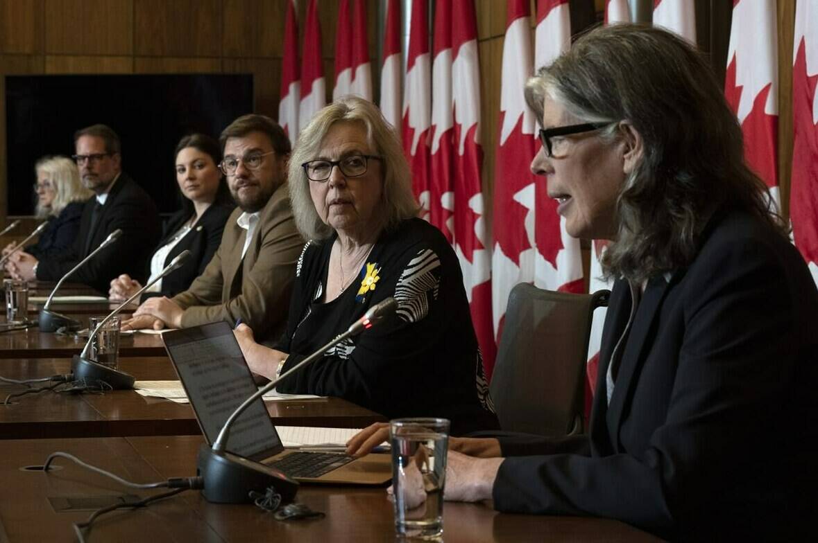 Physicist Ginette Charbonneau, NDP MP Alexandre Boulerice, Liberal MP Jenica Atwin, Bloc Quebecois MP Mario Simard and Green Party MP Elizabeth May listen to Coalition for Responsible Energy Development in New Brunswick’s Susan O’Donnell speak during a news conference in Ottawa, Tuesday, April 25, 2023. THE CANADIAN PRESS/Adrian Wyld