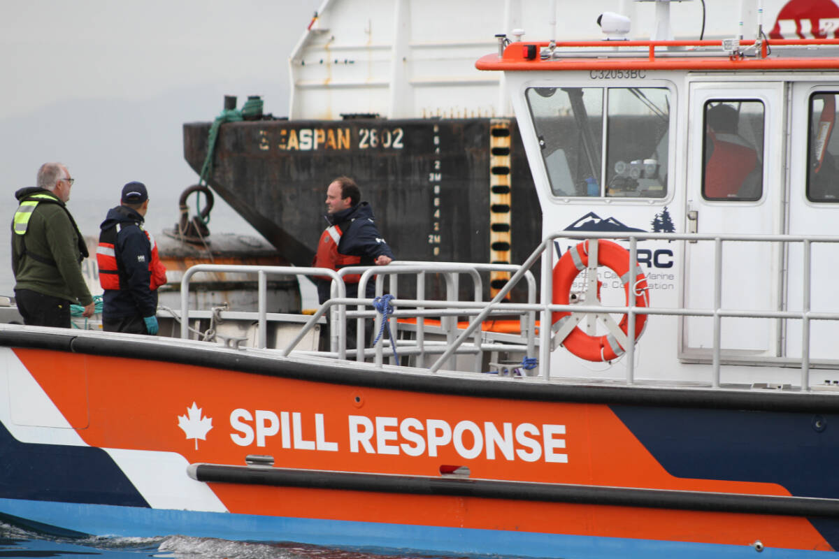 Crews with the Western Canada Marine Response Corporation conduct a simulated oil spill outside Esquimalt Harbour April 26. (Austin Westphal/News Staff)