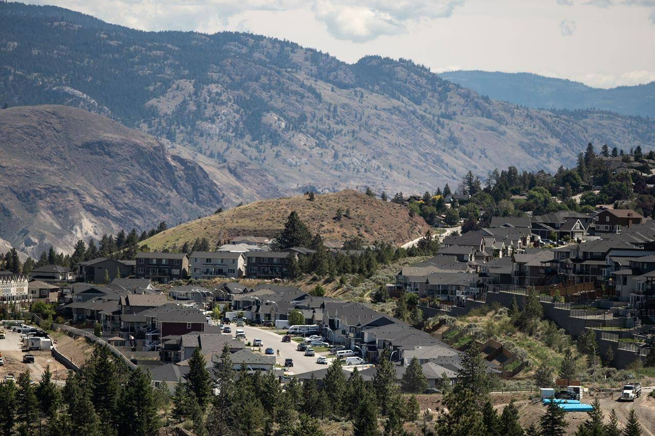 Houses are seen in Kamloops, B.C., on Tuesday, June 1, 2021. BC Financial Services Authority has issued its largest penalty to date against a Kamloops, B.C., woman who it says failed to comply with an order to cease unlicensed rental property management services. THE CANADIAN PRESS/Darryl Dyck