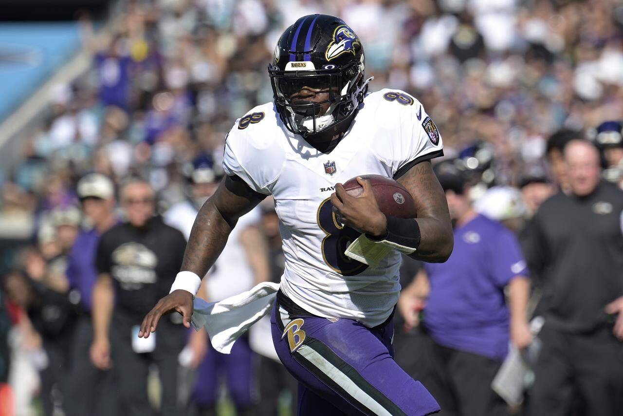 FILE - Baltimore Ravens quarterback Lamar Jackson (8) scrambles for yardage during the first half of an NFL football game the Jacksonville Jaguars, Sunday, Nov. 27, 2022, in Jacksonville, Fla. The Ravens agreed in principle with Jackson on a five-year deal Thursday, April 27, 2023, securing their star quarterback for the foreseeable future and ending a contract negotiation saga that was dominating the team’s offseason. (AP Photo/Phelan M. Ebenhack, File)