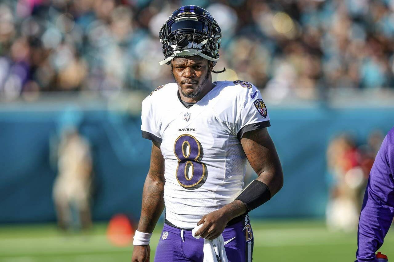 FILE - Baltimore Ravens quarterback Lamar Jackson (8) looks on during a timeout in the first half of an NFL football game against the Jacksonville Jaguars, Sunday, Nov. 27, 2022, in Jacksonville, Fla. The Ravens agreed in principle with Jackson on a five-year deal Thursday, April 27, 2023, securing their star quarterback for the foreseeable future and ending a contract negotiation saga that was dominating the team’s offseason. (AP Photo/Gary McCullough, File)