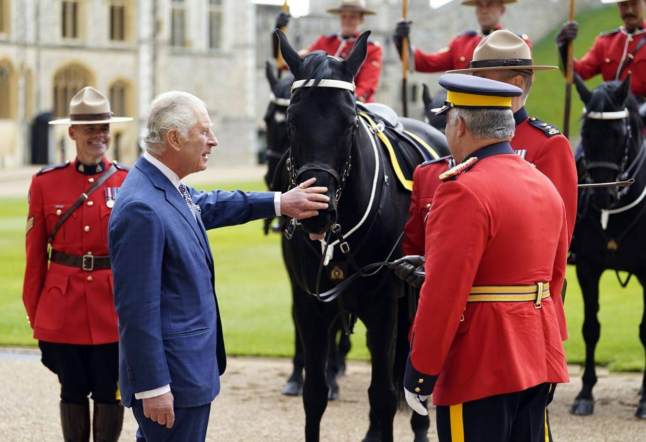 Britain’s King Charles III is presented with Noble, a horse given to him by the Royal Canadian Mounted Police (RCMP), as he formally accepts the role of Commissioner-in-Chief of the RCMP during a ceremony in the quadrangle at Windsor Castle, England, Friday April 28, 2023. The monarch will be officially crowned during a coronation ceremony on May 6. THE CANADIAN PRESS/Andrew Matthews, Pool Photo vis AP