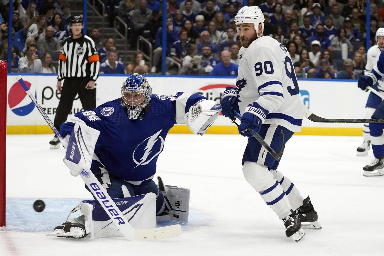 Toronto Maple Leafs center Ryan O’Reilly (90) chases a rebound after Tampa Bay Lightning goaltender Andrei Vasilevskiy (88) made a save during the first period in Game 6 of an NHL hockey Stanley Cup first-round playoff series Saturday, April 29, 2023, in Tampa, Fla. (AP Photo/Chris O’Meara)
