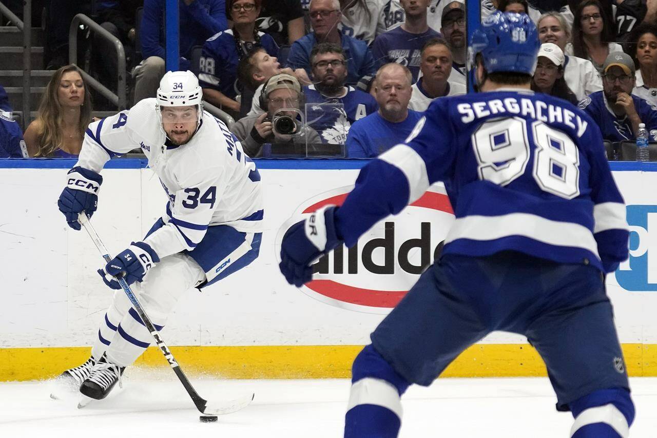 Toronto Maple Leafs center Auston Matthews (34) stops short in front of Tampa Bay Lightning defenseman Mikhail Sergachev (98) during the first period in Game 6 of an NHL hockey Stanley Cup first-round playoff series Saturday, April 29, 2023, in Tampa, Fla. (AP Photo/Chris O’Meara)