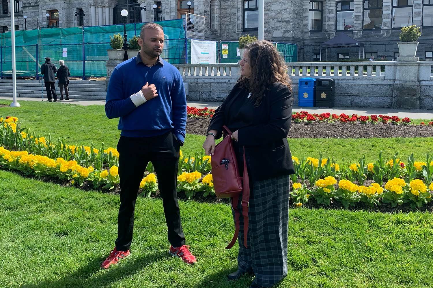 Aman Sood, a 40-year-old immigrant originally from India who came to Canada in 2019, suffered injuries during an attack from a fare while driving for Uber in Abbotsford last month. He and Sussanne Skidmore, BC Federation of Labour president, met with the media before meeting Minister of Labour Harry Bains to discuss the safety of workers for app-based companies like Uber. (Wolf Depner/News Staff)