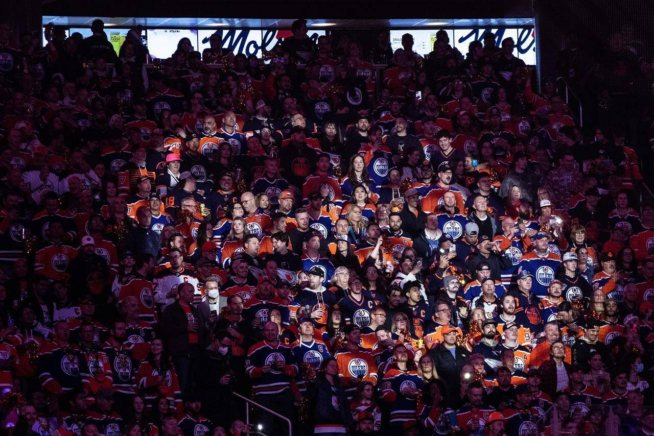 Fans look on before the NHL Stanley Cup first round playoff action between the Los Angeles Kings and the Edmonton Oilers in Edmonton on Tuesday, April 25, 2023. Police are promising a greater presence in downtown Edmonton after increased violence around the arena where the Oilers have been playing NHL playoff games. THE CANADIAN PRESS/Jason Franson
