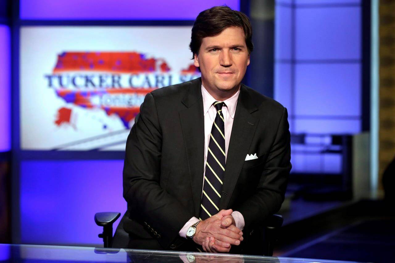 Tucker Carlson, then-host of “Tucker Carlson Tonight,” poses for photos in a Fox News Channel studio in New York, March 2, 2017. THE CANADIAN PRESS/AP-Richard Drew
