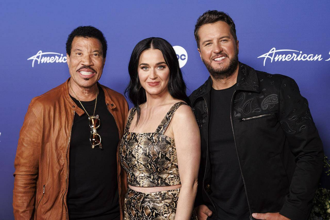 American Idol judges Lionel Richie, from left, Katy Perry and Luke Bryan arrive at the 20th Anniversary Celebration of “American Idol” on Monday, April 18, 2022 in Los Angeles. The last Canadian singer standing in this season’s “American Idol” has been cut from the reality TV show after making it to the top 10.THE CANADIAN PRESS/AP-Photo by Willy Sanjuan/Invision/AP