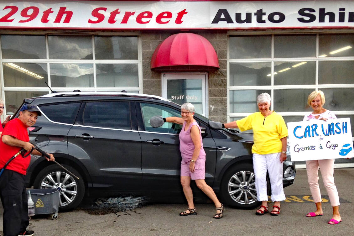 Louis Salvino, who worked 33 years for Watkin Motors and 29th St. Auto Shine, gives tips to Janis Lauman, Carol Schroeder, Anne Clarke, and Sue Ulmer in the art of car washing for Grannies à Gogo car wash, Sat, May 6.”