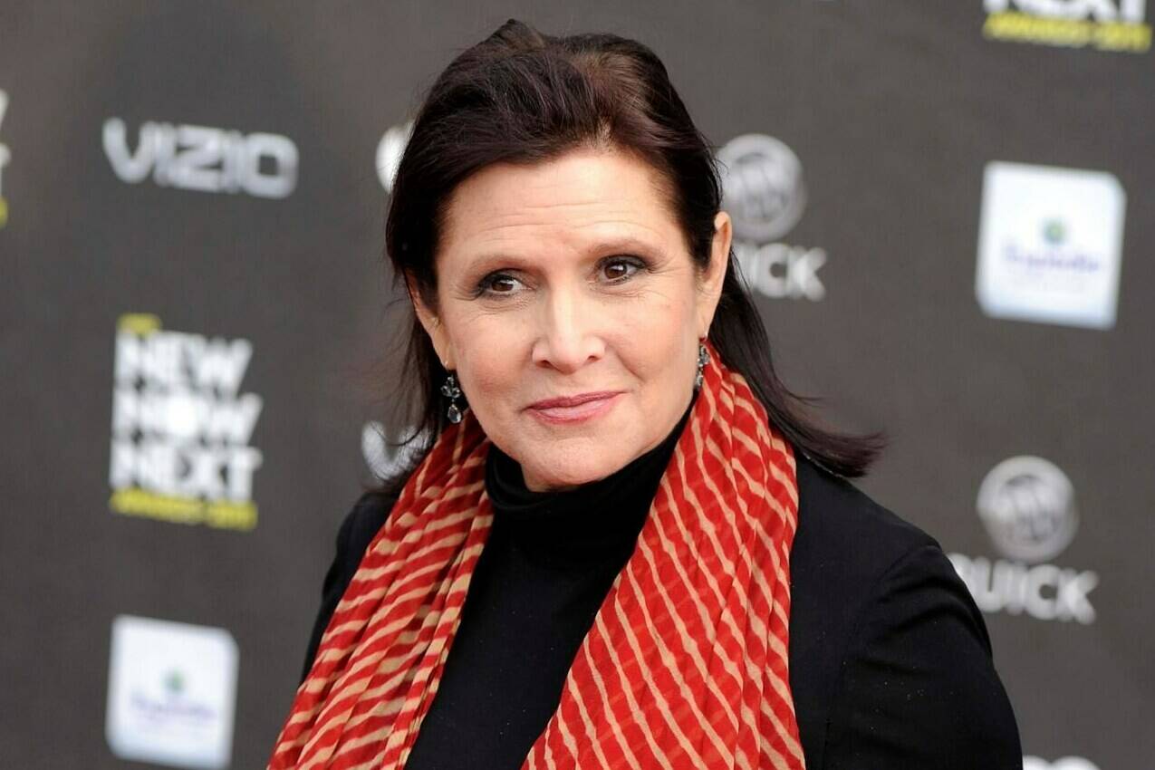 FILE - This April 7, 2011 file photo, shows Carrie Fisher at the 2011 NewNowNext Awards in Los Angeles. Fisher is receiving a star on the Hollywood Walk of Fame on Thursday, a May the Fourth tribute to one of the “Star Wars” franchise’s most beloved characters. (AP Photo/Chris Pizzello, File)