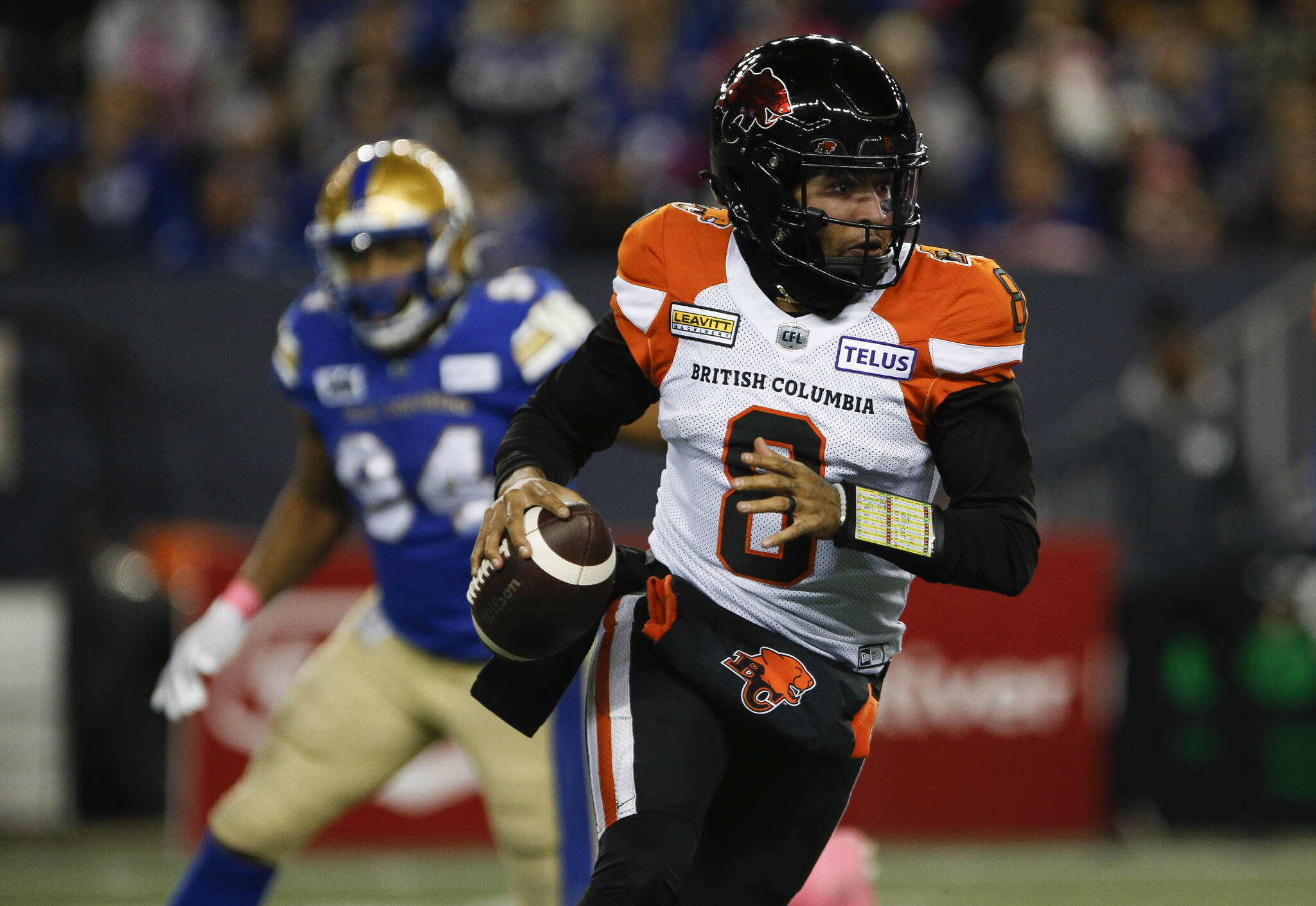 B.C. Lions quarterback Vernon Adams (8) runs for yards against the Winnipeg Blue Bombers during first half CFL action in Winnipeg Friday, October 28, 2022. THE CANADIAN PRESS/John Woods