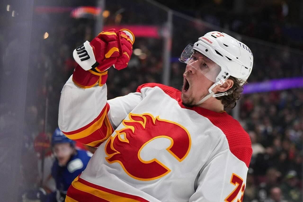 Calgary Flames' Tyler Toffoli celebrates his goal against the Vancouver Canucks during the second period of an NHL hockey game in Vancouver, on Friday, March 31, 2023. Toffoli and top prospect Adam Fantilli were among 20 players named Friday to Canada's roster for the upcoming world hockey championship. THE CANADIAN PRESS/Darryl Dyck