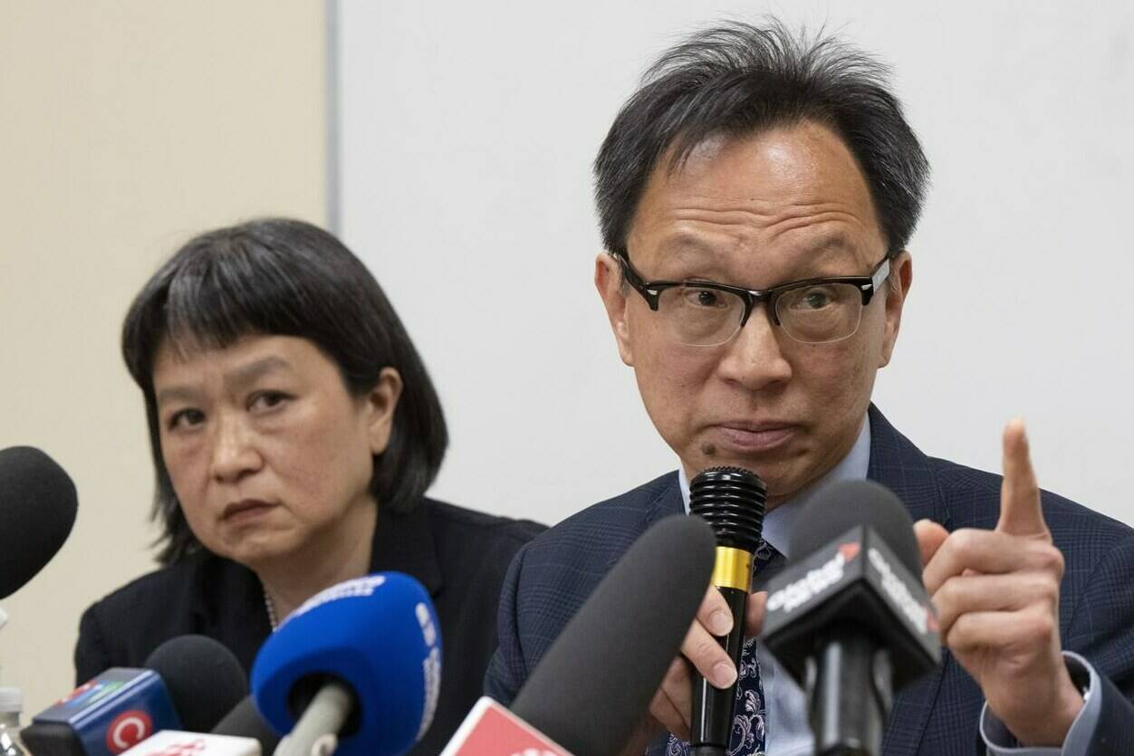 Sen. Yuen Pau Woo denounces RCMP allegations of Chinese government interference in Canada as community organizer May Chiu looks on during a news conference at the Service à la Famille Chinoise du Grand Montreal, Friday, May 5, 2023, in Montreal. THE CANADIAN PRESS/Ryan Remiorz