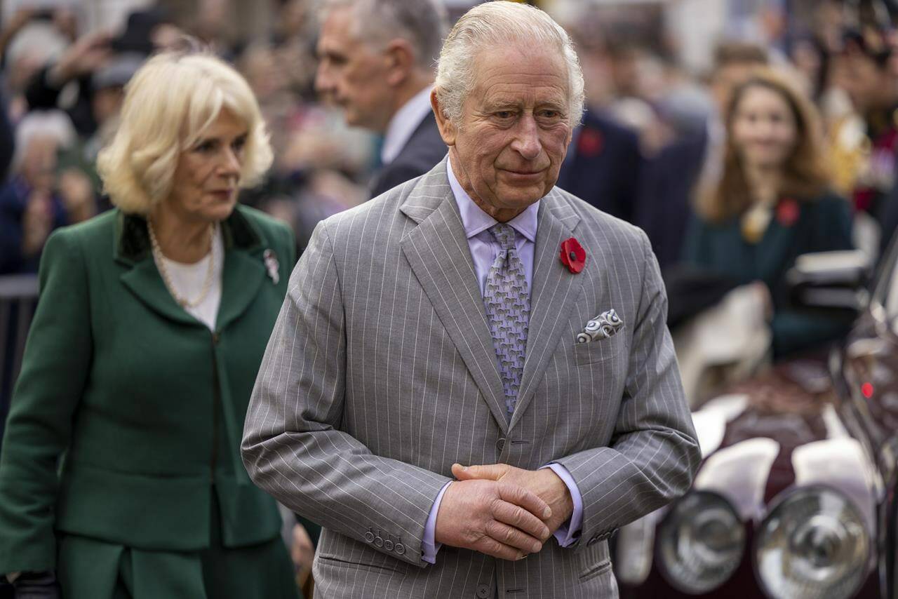 FILE - Britain’s King Charles III and Camilla, Queen Consort, walkabout to meet members of the public following a ceremony at Micklegate Bar, in York, England, Wednesday Nov. 9, 2022. King Charles III will travel to France and Germany for his first state visits since becoming monarch, underscoring Britain’s efforts to build bridges with its European neighbors. Buckingham Palace announced Friday, March 3, 2023 that Charles and Camilla, the queen consort, will visit the European Union’s two biggest countries March 26-31, hosted by Presidents Emanuel Macron of France and Frank-Walter Steinmeier of Germany. (James Glossop/Pool Photo via AP, File)