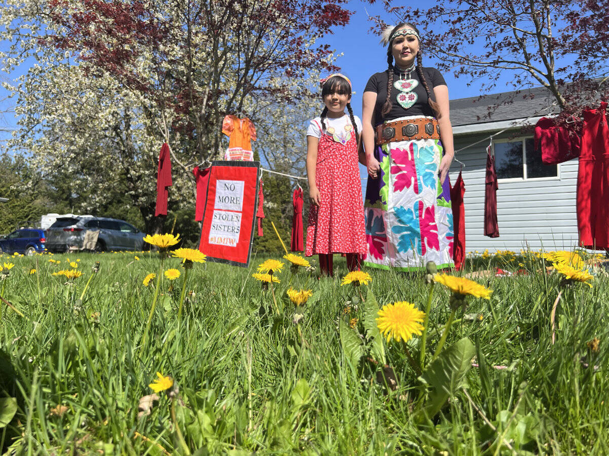 Alysha Archie and her 10-year-old daughter Donna at her grandfather’s house on the Skowkale reserve in Chilliwack on April 28, 2023. Archie has been the victim of repeat domestic abuse and annually puts up a display of red dresses on May 5 to honour the hundreds of missing and murdered Indigenous women and girls in Canada. (Paul Henderson/ Chilliwack Progress)
