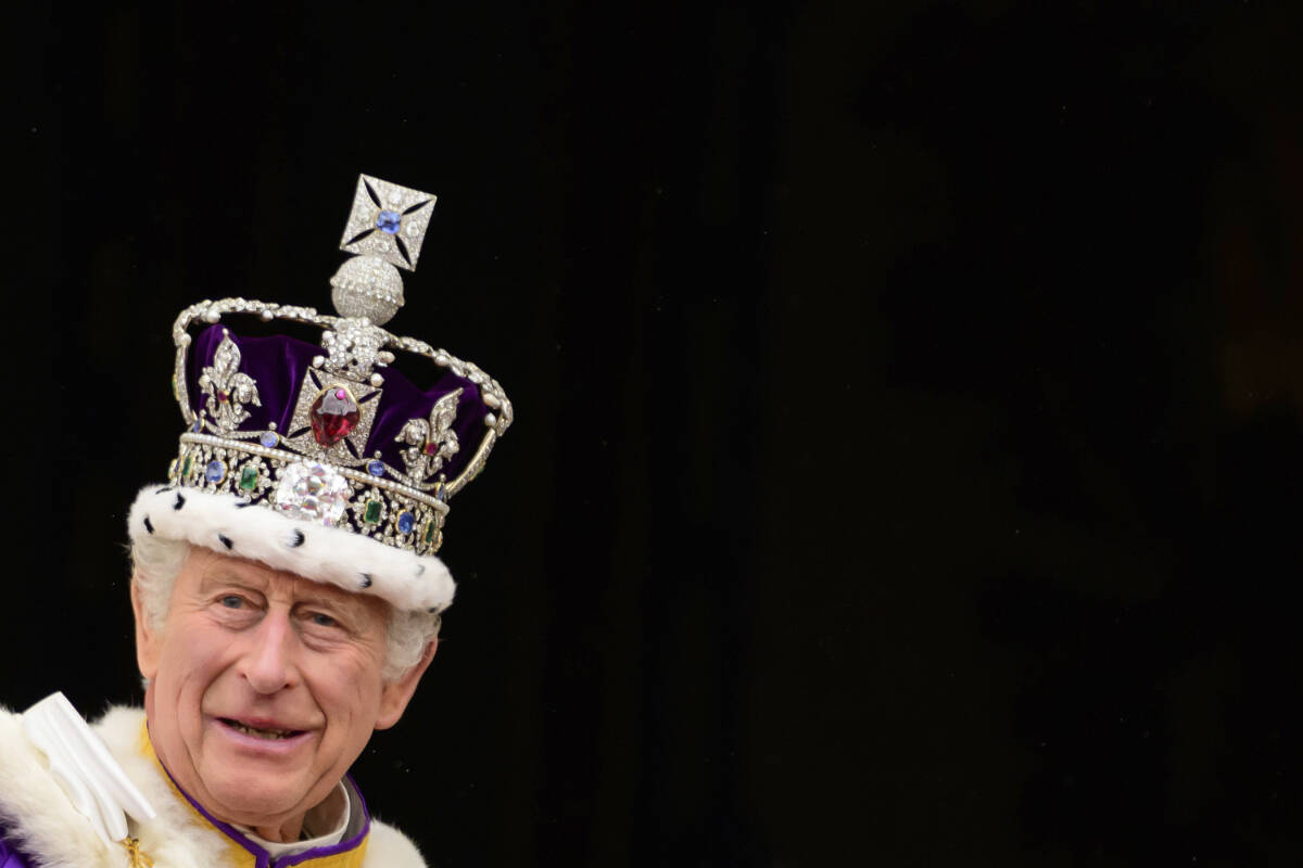 Britain’s King Charles III waves from the Buckingham Palace balcony after his coronation, in London, Saturday, May 6, 2023. (Leon Neal/Pool Photo via AP)