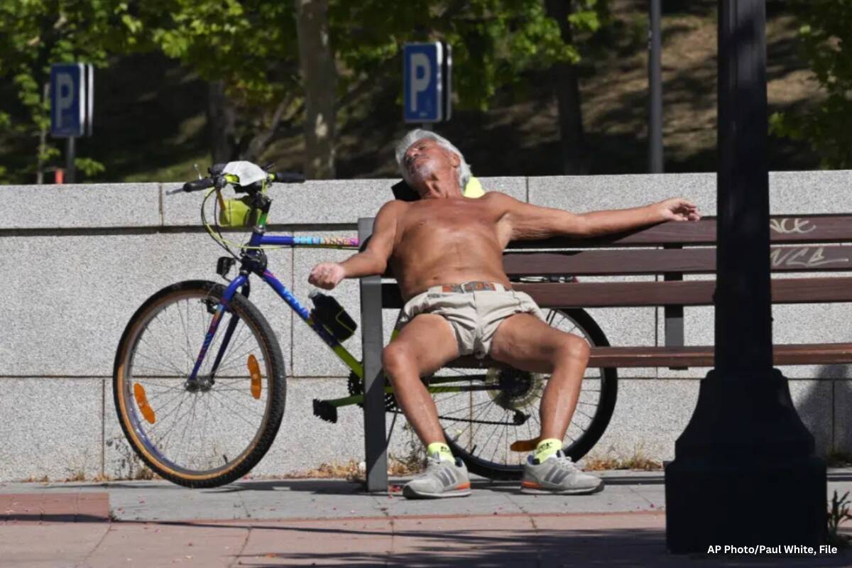 A man sunbathes on a hot spring day in Madrid, Spain, on April 18, 2023. Drought-stricken Spain says last month was the hottest and driest April since records began in 1961. The State Meteorological Agency, said Monday May 8, 2023 the average daily temperature in April was 14.9 degrees Celsius (58.8 Fahrenheit), that is 3 degrees Celsius above the average. (AP Photo/Paul White, File)