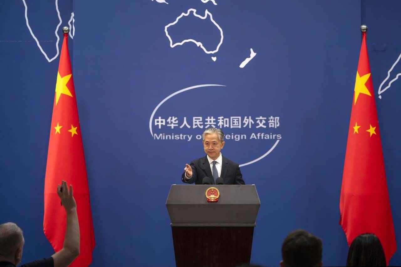 Chinese Foreign Ministry spokesperson Wang Wenbin gestures during a regular press conference in Beijing, Tuesday, May 9, 2023. China announced the expulsion of a Canadian diplomat on Tuesday in retaliation for Ottawa ordering a Chinese consular official to leave the country over alleged threats he made against a Canadian lawmaker and his family. (AP Photo/Mark Schiefelbein)