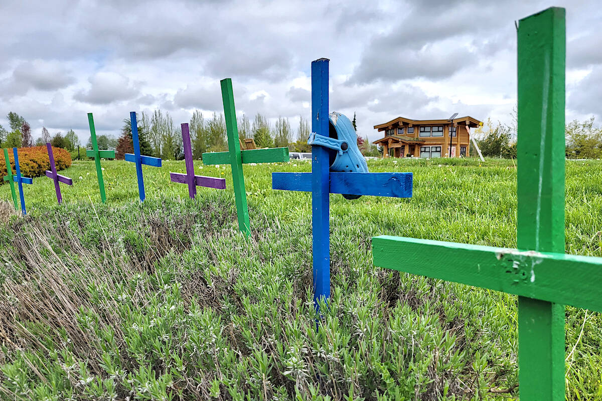 On Sunday, May 8, small row of painted crosses remained at Derek Doubleday Arboretum in Langley to honour the memory of the 215 children’s graves discovered at Kamloops Indian Residential School (Dan Ferguson/Langley Advance Times)