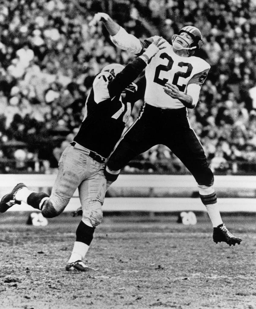 B.C. Lions quarterback Joe Kapp (22) gets his pass away under pressure from Pete Neumann (74) of the Hamilton Tiger-Cats during the third quarter of CFL Grey Cup action in Toronto on Nov. 28, 1964. Time does not necessarily heal all wounds.Former CFL legends Joe Kapp and Angelo Mosca became involved in a fight Friday during a CFL alumni luncheon. A video of the incident on YouTube showed Kapp attempting to give Mosca flowers as an apparent peace offering and Mosca rejecting the gesture with an expletive.THE CANADIAN PRESS/CP