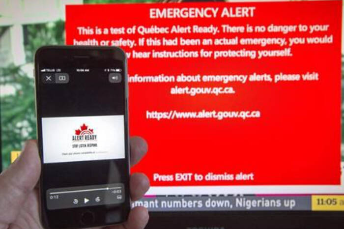 A smartphone and a television receive visual and audio alerts to test Alert Ready, a national public alert system. A test of the alert system will take place across B.C. at 1:55 p.m. Wednesday, May 10, 2023. THE CANADIAN PRESS/Ryan Remiorz
