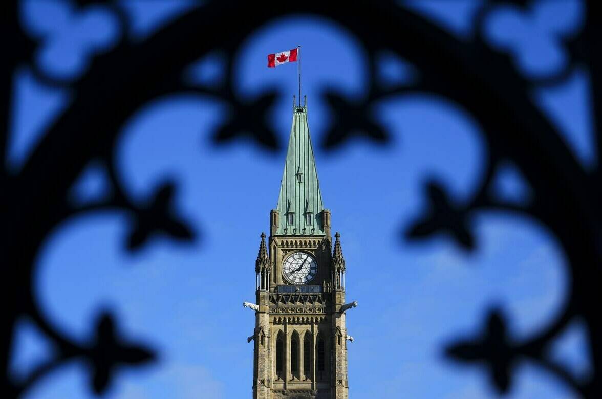 The Canada flag flies atop the Peace Tower on Parliament Hill in Ottawa on Friday, May 5, 2023. The managing director of a non-profit that tracks Chinese attempts to influence democracies around the world says Beijing wants to sow discord in western countries. THE CANADIAN PRESS/Sean Kilpatrick