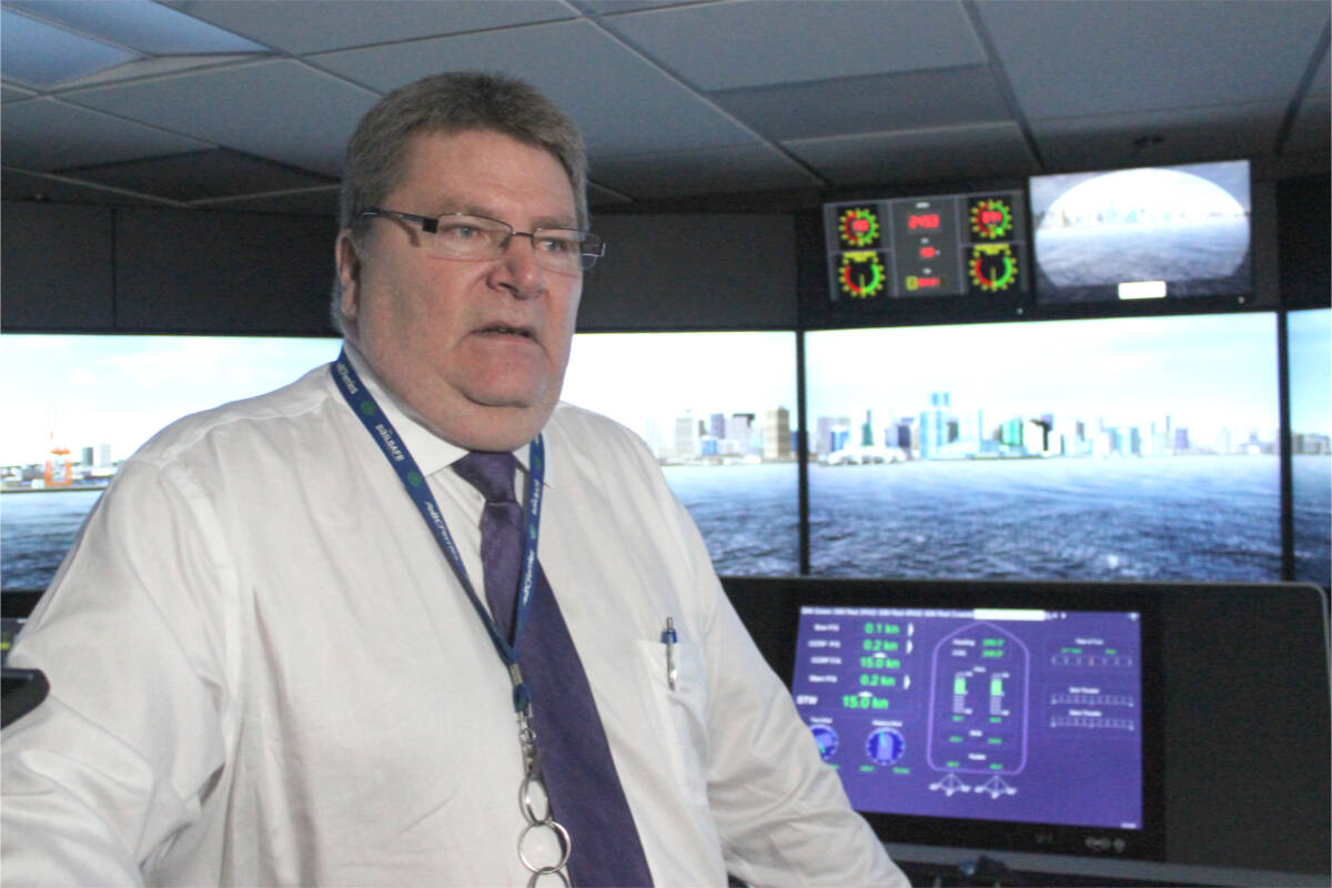Capt. Malcolm Rodger, B.C. Ferries’ manager of simulation training, talks about computer equipment used to train employees to operate vessels during a demonstration at the Departure Bay ferry terminal on May 10. (Karl Yu/News Bulletin)