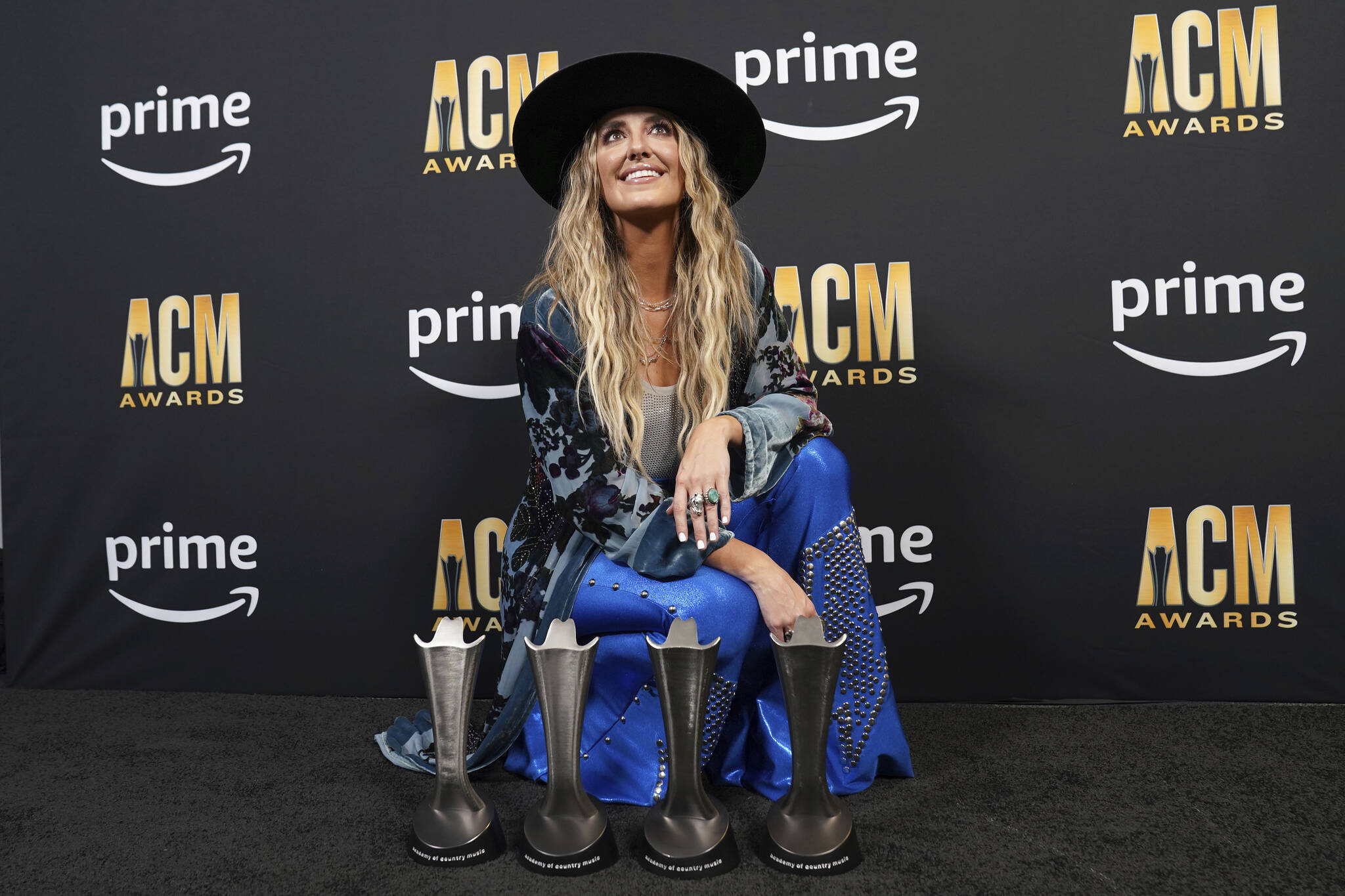 Lainey Wilson poses with the awards for album of the year for “Bell Bottom Country”, female artist of the year, music event of the year for “Wait in the Truck”, and visual media of the year for “Wait in the Truck”, in the press room at the 58th annual Academy of Country Music Awards on Thursday, May 11, 2023, at the Ford Center in Frisco, Texas. (AP Photo/Jeffrey McWhorter)