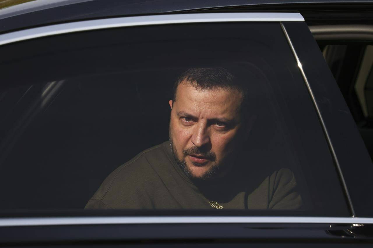 Ukraine’s President Volodymyr Zelenskyy is seen in a car during a visit at a military air base in Soesterberg, Netherlands, Thursday, May 4, 2023. (Yves Herman/Pool via AP)