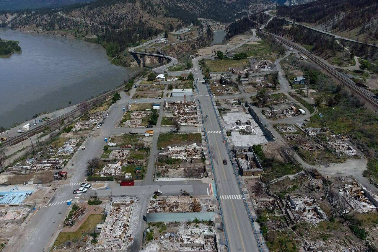 The ruins of houses and businesses are seen in Lytton, B.C., on Wednesday, June 15, 2022, almost a year after the town was destroyed by fire during the heat dome weather event. THE CANADIAN PRESS/Darryl Dyck