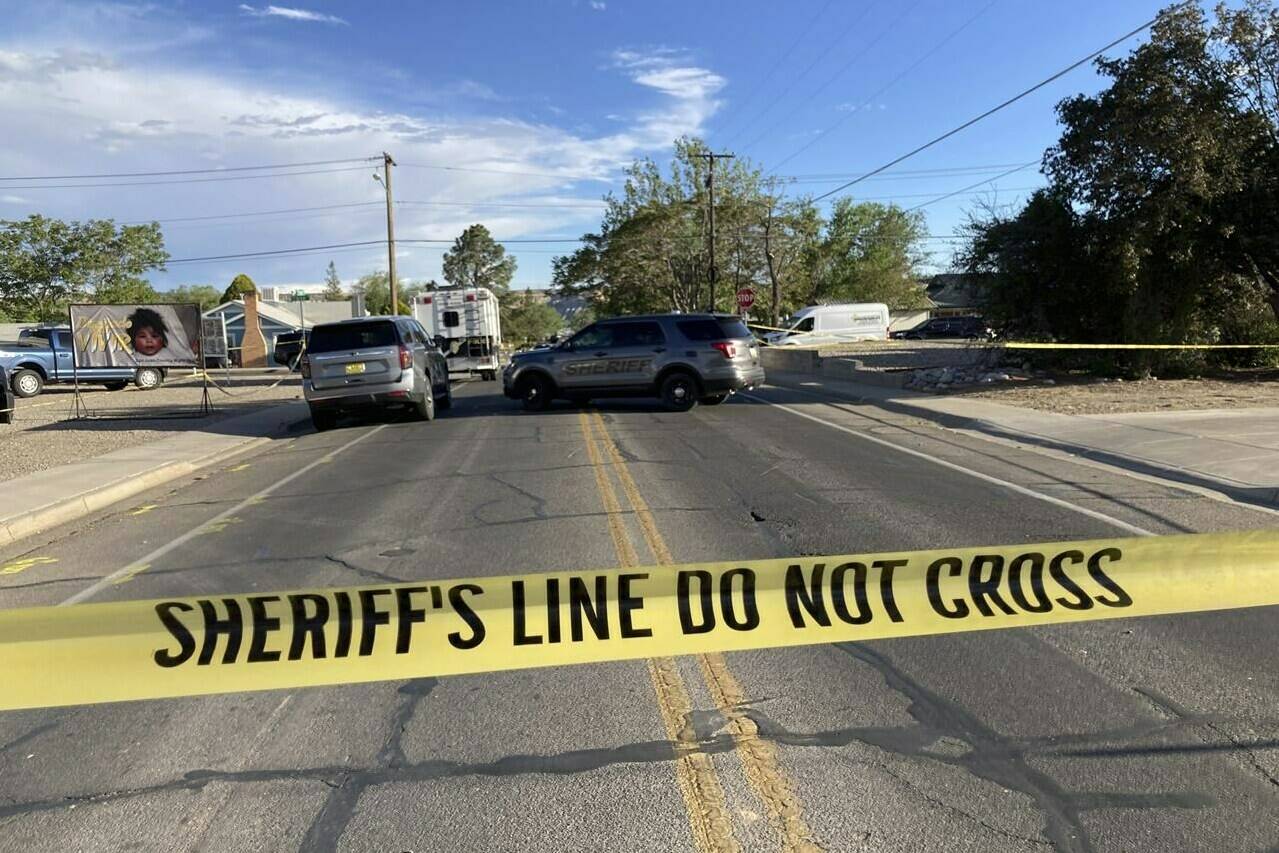 Law enforcement officers cordon off roads following a deadly shooting Monday, May 15, 2023, in Farmington, N.M. Authorities said an 18-year-old opened fire in the northwestern New Mexico community killing multiple people and injuring others before law enforcement fatally shot the suspect. (AP Photo/Susan Montoya Bryan)
