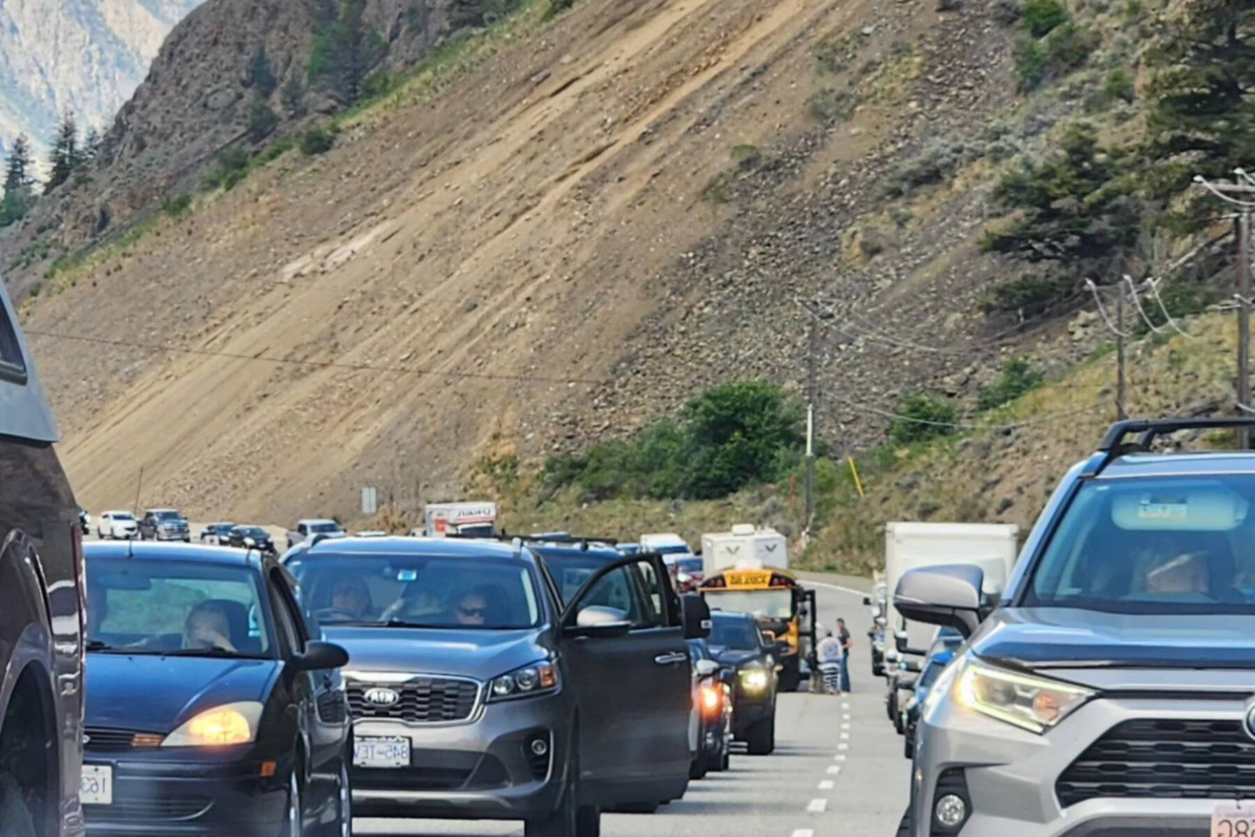 Traffic along Highway 3 was backed up in both directions on May 15 while emergency crews recovered a vehicle and two deceased occupants from the Similkameen River. (Spencer Coyne - Facebook)