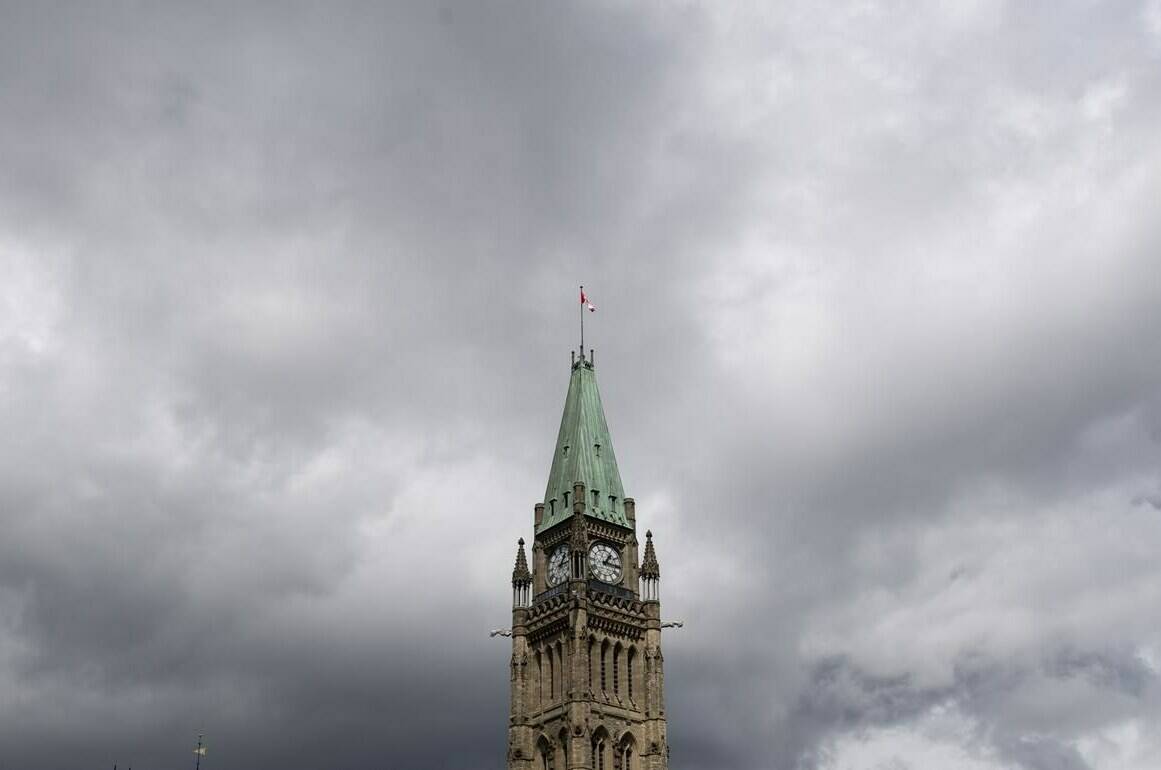 Storm clouds pass by the Peace Tower and Parliament Hill Tuesday August 18, 2020 in Ottawa.THE CANADIAN PRESS/Adrian Wyld
