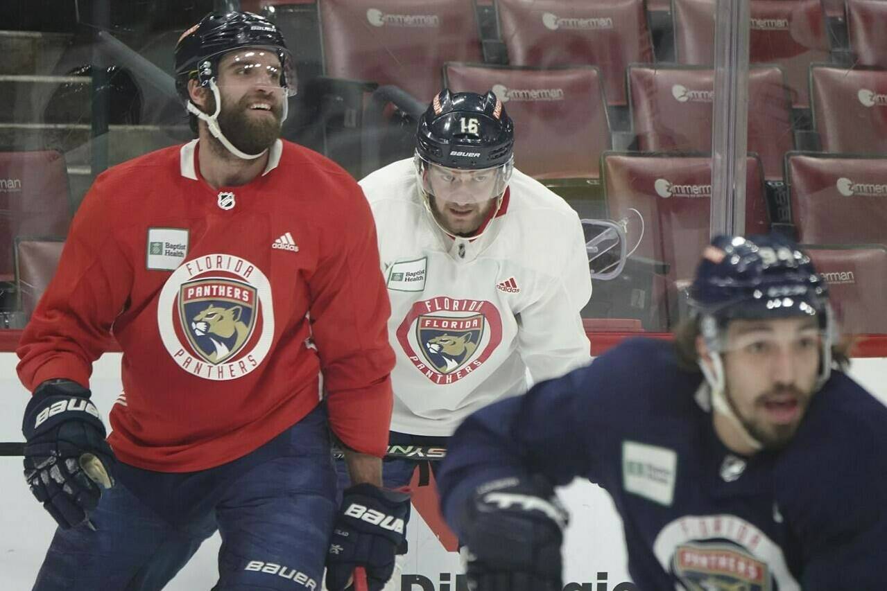 Florida Panthers Aaron Ekblad, left, Aleksander Barkov, and Ryan Lomberg, right, skate during hockey practice Monday, May 15, 2023 at FLA Live Arena in Sunrise, Fla. The team travels to take on the Carolina Hurricane in a Stanley Cup semi-final series. (Joe Cavaretta/South Florida Sun-Sentinel via AP)