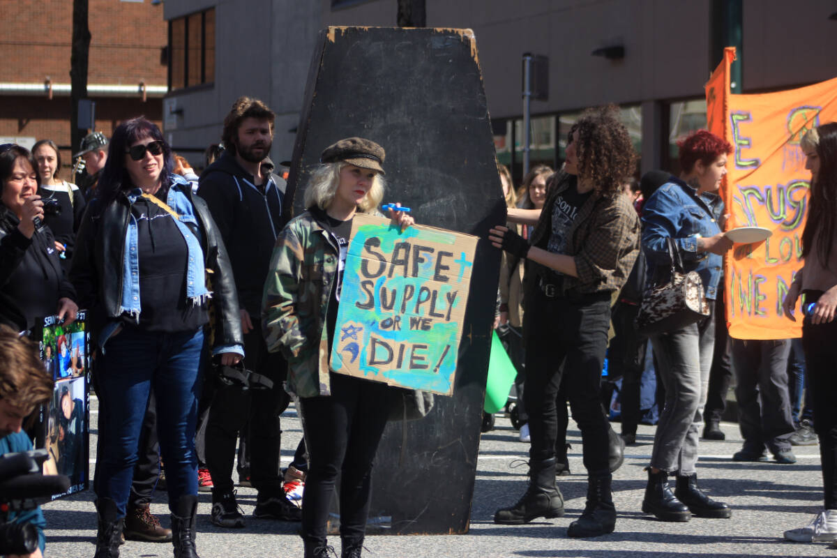 Protesters stop at the intersection of Powell and Main streets in Vancouver to listen to speeches on April 14, 2023 during an event marking the seventh anniversary of the toxic drug deaths in B.C. (Lauren Collins photo)