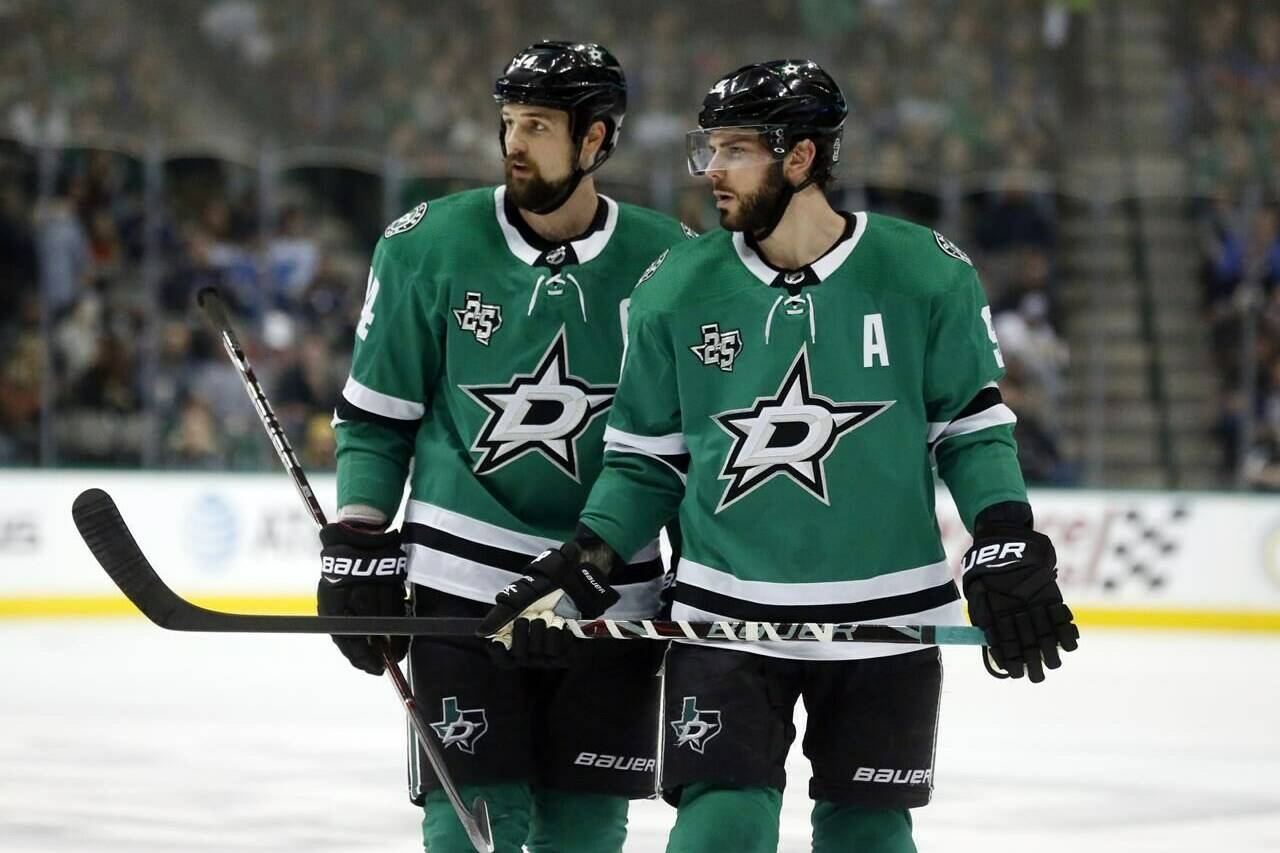 FILE - In this Friday, Dec. 29, 2017 file photo, Dallas Stars left wing Jamie Benn (14) and center Tyler Seguin (91) look over the St. Louis Blues defense during the first period of an NHL hockey game in Dallas.Jamie Benn and Tyler Seguin were regularly among the NHL’s top scorers when they first started playing together in Dallas a decade ago. Now 30-something forwards, Benn the captain and six-time All-Star Seguin are far removed from skating together on the top line, or even leading their own team in scoring while having the two biggest contracts on the Stars roster.(AP Photo/Michael Ainsworth, File)