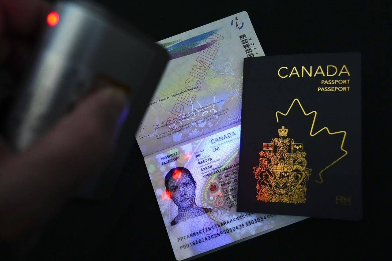 The new Canadian passport is unveiled at an event at the Ottawa International Airport in Ottawa on Wednesday, May 10, 2023. Passport controversy just the latest battle in the culture war over Canadian identity. THE CANADIAN PRESS/Sean Kilpatrick