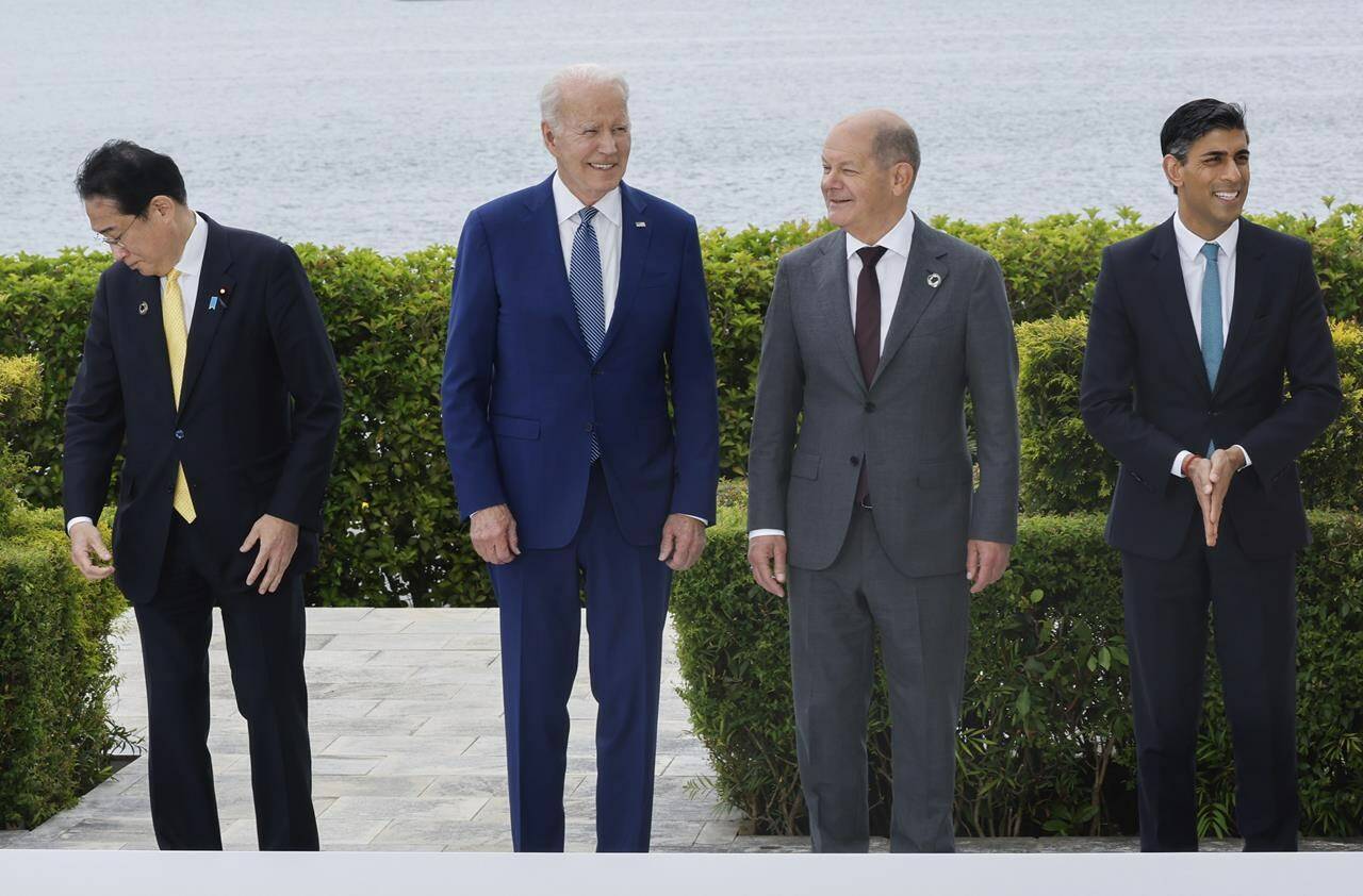 From left to right, Japan’s Prime Minister Fumio Kishida, U.S. President Joe Biden, Germany’s Chancellor Olaf Scholz and Britain’s Prime Minister Rishi Sunak participate in a family photo with G7 leaders before their working lunch meeting on economic security during the G7 summit, at the Grand Prince Hotel in Hiroshima, western Japan Saturday, May 20, 2023. (Jonathan Ernst/Pool Photo via AP)