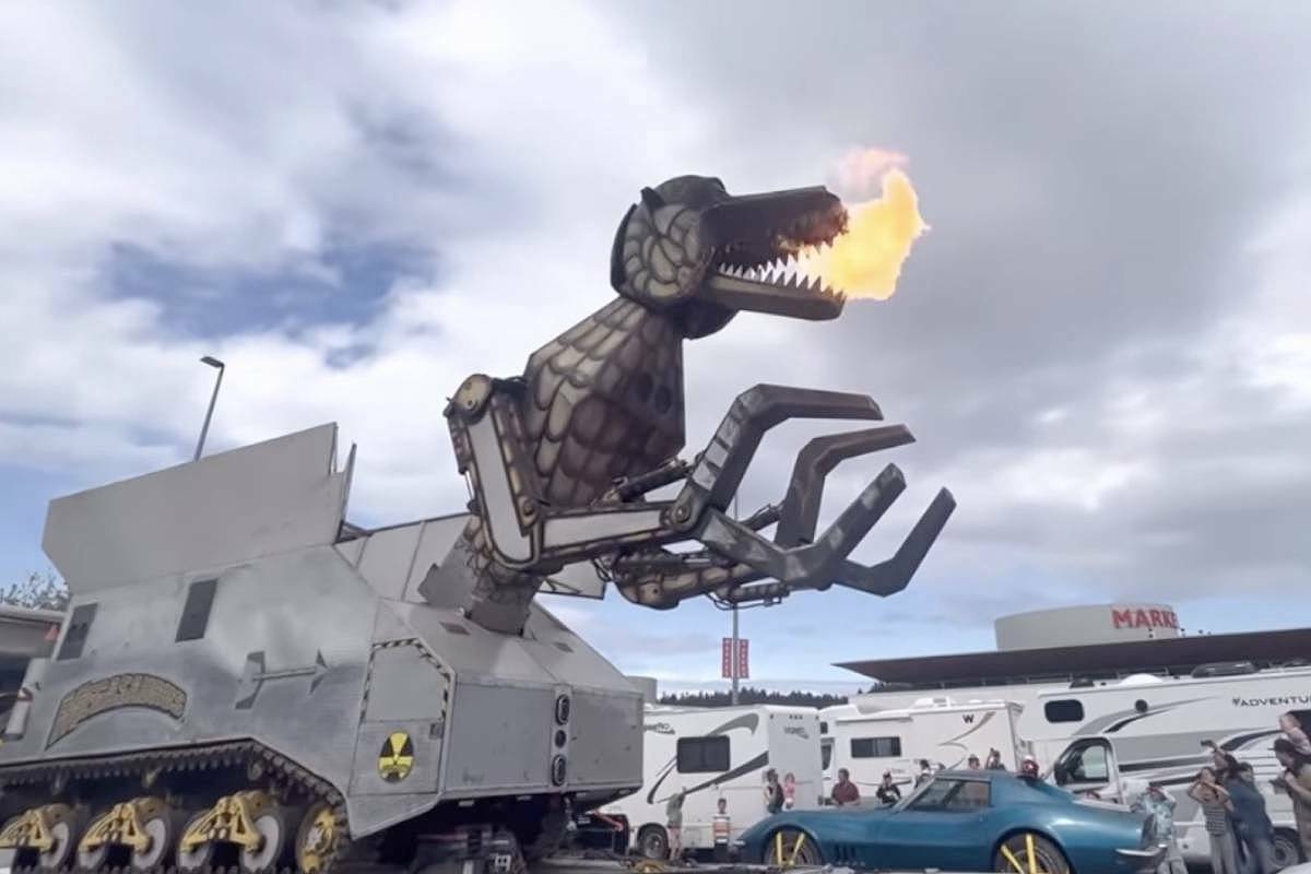 Megasauraus, the fire-breathing mechanical T-rex, rears its head and puts on a show for passengers at the Departure Bay ferry terminal in Nanaimo on Monday, May 22. (Photo by Vincent Akard)