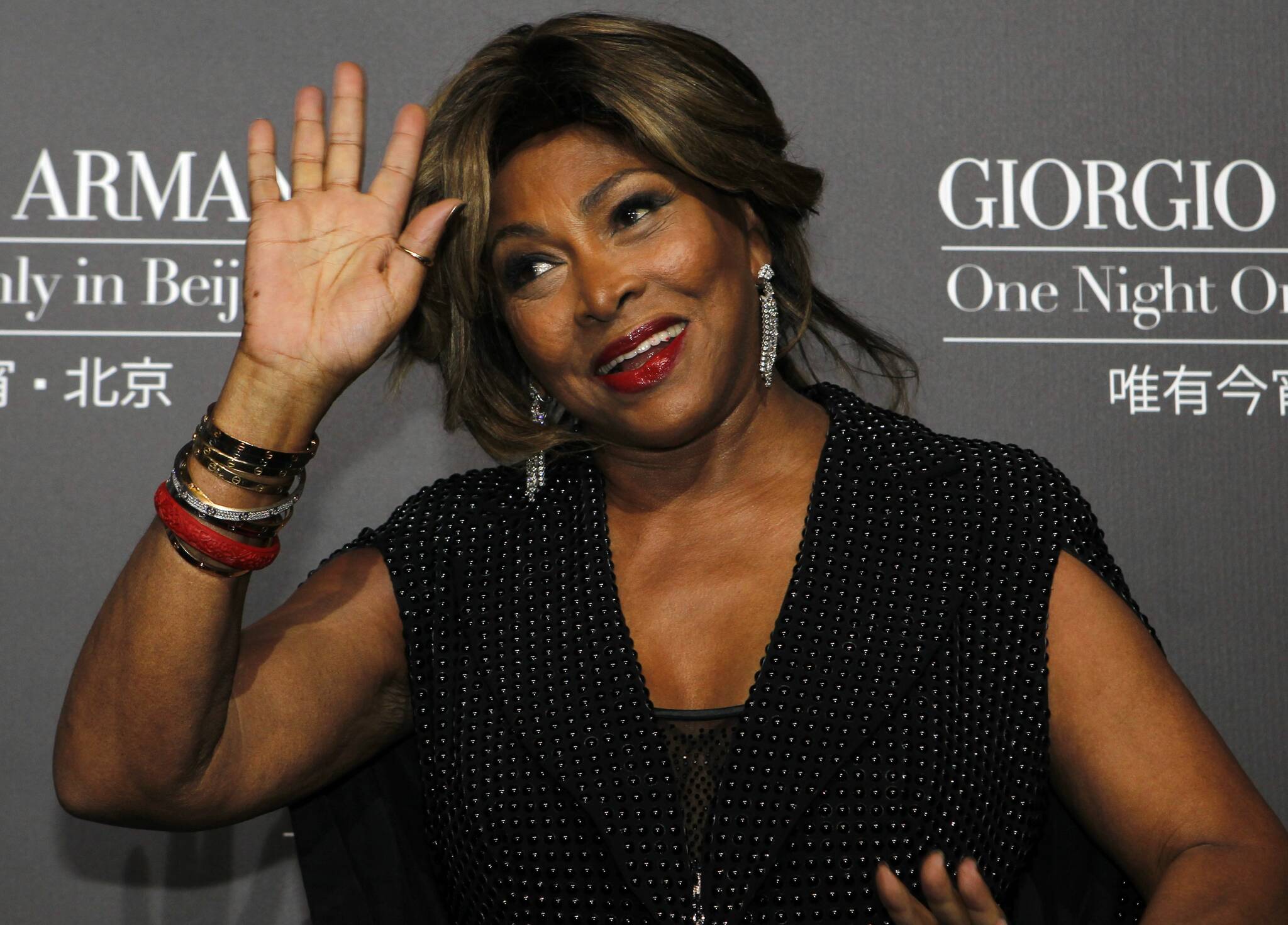 FILE - A Thursday, May 31, 2012 photo from files showing U.S. singer actress Tina Turner arriving for the Giorgio Armani fashion show held in Beijing. Legendary rock singer Tina Turner has married her longtime German beau, Erwin Bach, in a Swiss civil ceremony. The mayor of Kuesnacht, the wealthy Zurich-area community where Turner lives, says that she and Bach, a music executive, were married several weeks ago at the registry office. Markus Ernst told The Associated Press on Thursday, July 18, 2013, it was a routine ceremony, ahead of a private celebration on Sunday at the couple’s home. (AP Photo/Ng Han Guan, File)