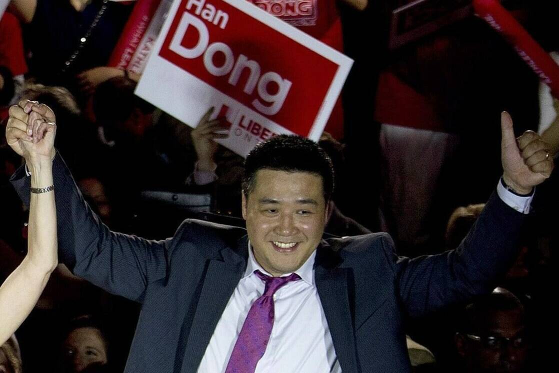 Provincial Liberal candidate Han Dong celebrates with supporters while taking part in a rally in Toronto on Thursday, May 22, 2014. Prime Minister Justin Trudeau is leaving the door open should Independent MP Han Dong decide he wants to rejoin the Liberal party. THE CANADIAN PRESS/Nathan Denette