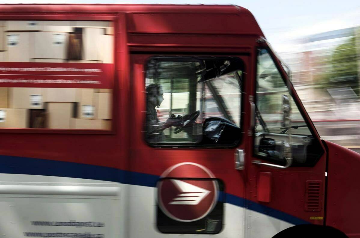 The Canadian Union of Postal Workers says it has agreed to settle its lawsuit against Jewish activist group B’nai Brith Canada. A Canada Post employee drives a mail truck through downtown Halifax on Wednesday, July 6, 2016. THE CANADIAN PRESS/Darren Calabrese