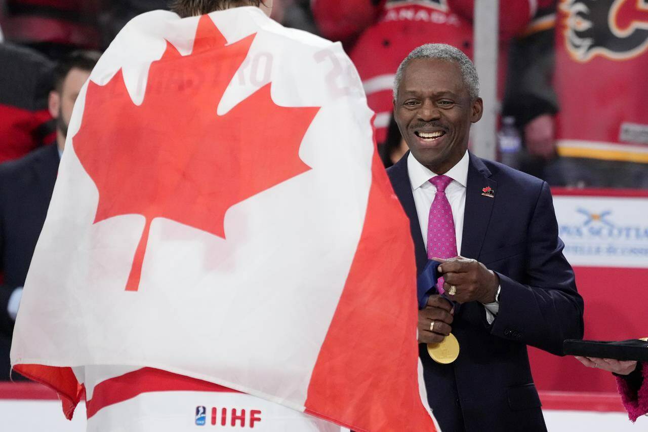 Hugh Fraser, Hockey Canada Board Chair, prepares the gold medals during the medal ceremony of the IIHF World Junior Hockey Championship gold medal game in Halifax on Thursday, January 5, 2023. THE CANADIAN PRESS/Darren Calabrese
