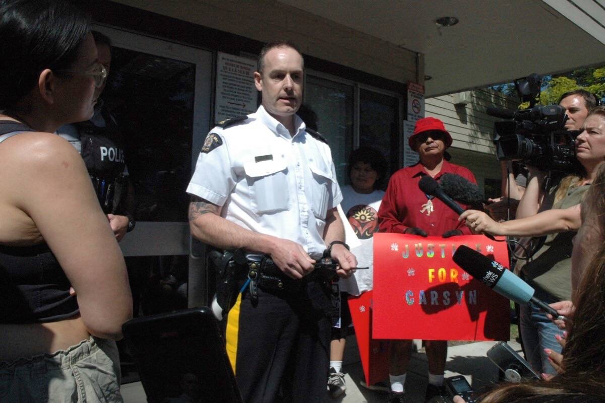 Insp. Chris Bear, head of the North Cowichan RCMP detachment, speaks to crowd of protestors outside the detachment on May 26 who have taken issue with the RCMP's handling of a case involving the death of teenager Carsyn Mackenzie Seaweed. (Robert Barron/Citizen)