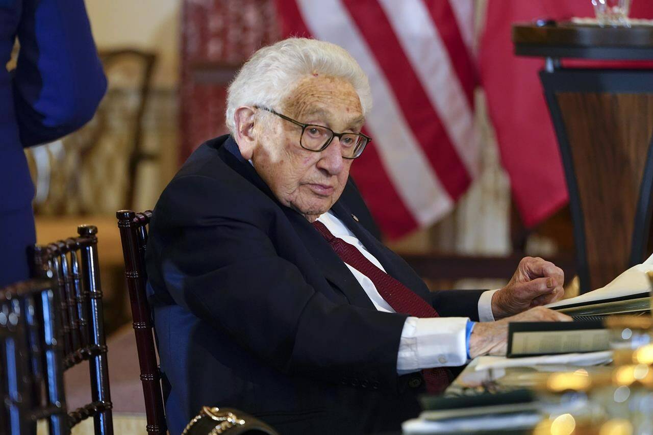 FILE - Former U.S. Secretary of State Henry Kissinger attends a luncheon with French President Emmanuel Macron, Vice President Kamala Harris and Secretary of State Antony Blinken, Thursday, Dec. 1, 2022, at the State Department in Washington. Kissinger marks his 100th birthday on Saturday, May 27, 2023, outlasting many of his political contemporaries who guided the United States through one of its most tumultuous periods including the presidency of Richard Nixon and the Vietnam War. (AP Photo/Jacquelyn Martin, File)
